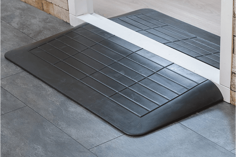 Robot Vacuum thresholds ramps made of rubber lie in front of a high threshold.